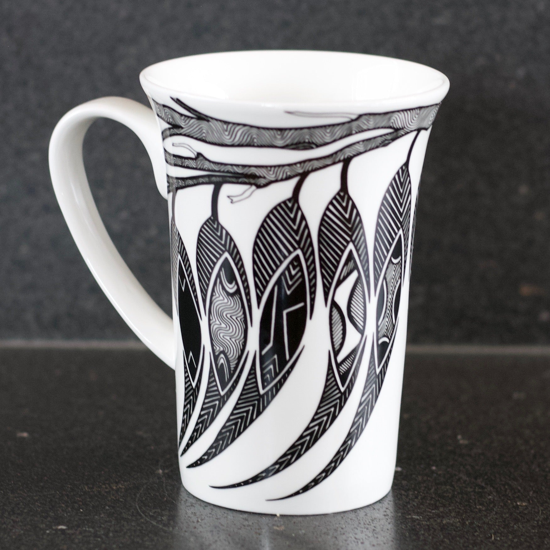 Dancing Wombat Mug with gum leaves by Mick Harding,